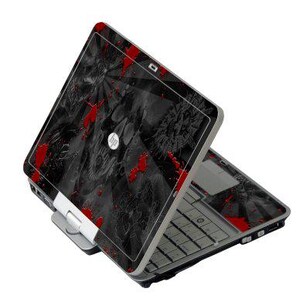 May include: A black and gray HP laptop with a red splatter design. The laptop is open, revealing the keyboard and screen. The design features a skull and floral pattern.