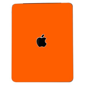 May include: Orange laptop skin with the Apple logo in black.