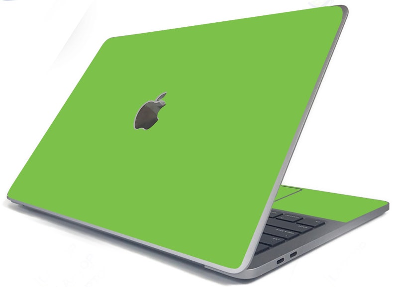May include: A green laptop computer with the Apple logo on the lid. The laptop is closed and the screen is facing away from the viewer.
