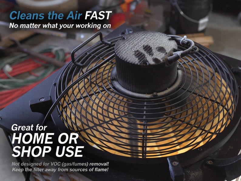 May include: A black fan with a metal grate and a white filter. The fan is on and the filter is covered in dust. The text "Cleans the Air FAST" is at the top of the image. The text "Great for HOME OR SHOP USE" is at the bottom of the image. The text "Not designed for VOC (gas/fumes) removal! Keep the filter away from sources of flame!" is below the text "Great for HOME OR SHOP USE".