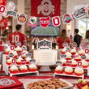 May include: An Ohio State Buckeyes themed party display featuring a white frosted cake with a topper, cupcakes with branded picks, red and white balloons, a banner, napkins, and bowls of snacks, all decorated with the team logo and colors.