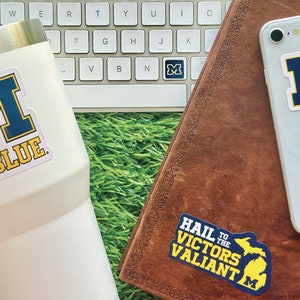 Michigan Wolverines Stickers (14 Pieces) 2 car window (5&quot;) + 10 waterbottle (2&quot;) + 2 mini keyboard decals U of M Gift for Men and Women