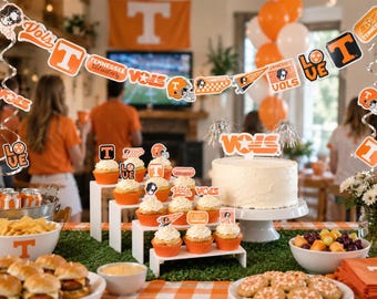 May include: A Tennessee Volunteers themed party decoration set featuring a hanging banner with team logos and text, orange and white cupcake toppers, and a large cake topper with the word Vols, all displaying the team's signature orange and white colors.
