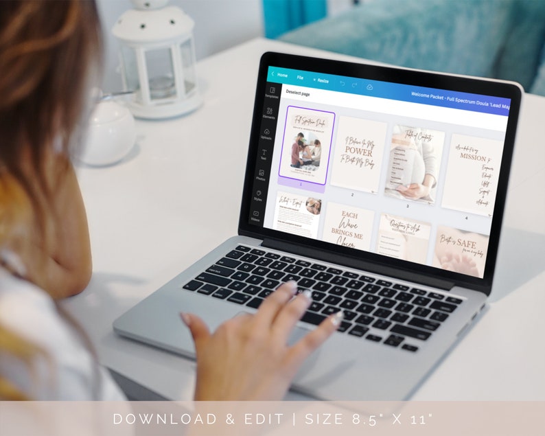 A person is using the Canva program on their computer. Canva is open to view all on a welcome packet or lead generator template. All pages are branded together in similar grey tones and have a beautiful soft minimal aesthetic.