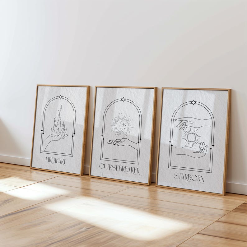 May include: Three minimalist black and white prints with arched frames and hand drawn illustrations. The prints are titled "Fireheart", "Cursebreaker", and "Starborn".