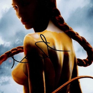 Angelina Jolie BEOWULF hand signed in person autograph on 8x10 photo of her in the movie. Comes with certificate of authenticity COA.
