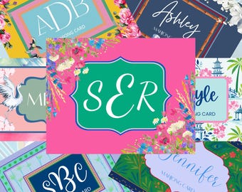 May include: A collection of rectangular mahjong cards featuring various designs, including floral patterns, bird illustrations, and personalized monograms or names like ADB, Ashley, SER, and Jennifer, displayed in a layered, overlapping arrangement.