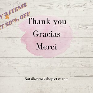 May include: A white ceramic mug with a black handle and the text "But first, coffee" in a black, handwritten-style font. The mug is on a white surface.