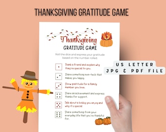 May include: A printable Thanksgiving gratitude game with a scarecrow illustration and a pumpkin with a turkey on top. The game includes instructions to roll a dice and express gratitude based on the number rolled. The game includes prompts such as "Thank a friend and explain why they're special to you." and "Share something non-tech that makes you happy."