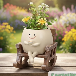 May include: A whimsical cream-colored planter shaped like a smiling character, holding a cup, and seated in a wooden rocking chair. The planter is filled with yellow and white flowers. The background shows a colorful garden. The text "Malinda Boutiques" is at the top.