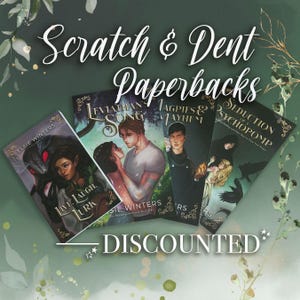 May include: Five paperback books with different covers are arranged in a fan shape. The books are discounted and labeled "Scratch & Dent Paperbacks". The covers feature a variety of illustrations, including a wolf, a couple, a dragon, and a raven.