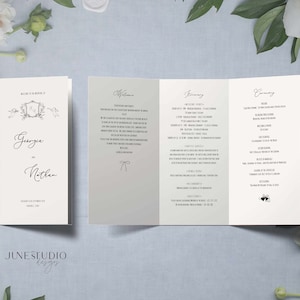 May include: A wedding programme with a white background and black text. The programme includes a welcome message, a ceremony order, and a reception schedule. The names "Georgie and Nathan" are printed on the front cover.