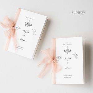 May include: Two white wedding ceremony programmes with a black and white illustration of a chandelier and cherubs. The programmes are tied with a light pink ribbon. The text on the programmes reads "Welcome to the wedding of Angela & Simon Saturday 24th September 2020 South Yarra, Victoria"