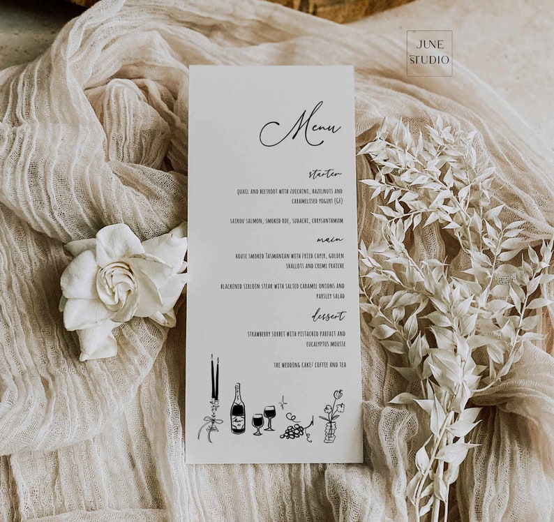 May include: A white menu card with black text listing the menu for a wedding reception. The menu includes starter, main, dessert, and the wedding cake, coffee, and tea. The card is decorated with simple black line drawings of candles, wine glasses, grapes, and a plant.