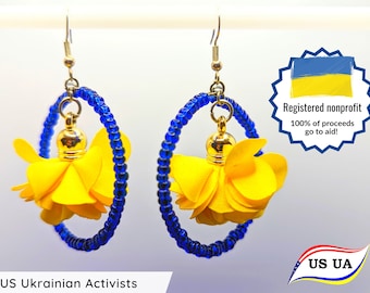 Handmade orbit bead and flower earrings for Ukraine. All proceeds go to direct aid!