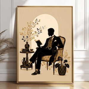May include: A framed wall art print featuring a black silhouette of a person in a formal suit and patterned vest sitting in an ornate armchair, reading a book. Beside them is a small round table with books, a vase with branches, and a teacup.