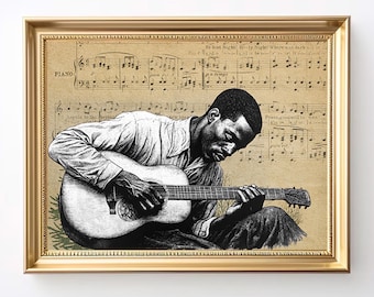 May include: A framed print featuring a black and white illustration of a man playing an acoustic guitar. The background is a sepia-toned sheet music design. The frame is gold.