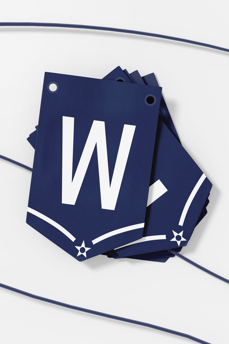 May include: A navy blue banner with a white star and the letter "W" in white. The banner is folded and has a hole at the top for hanging.