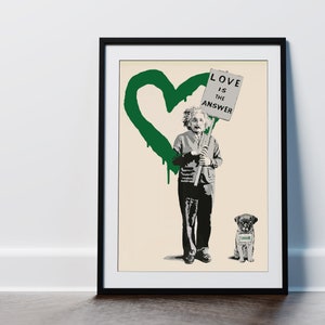May include: Framed art print with a stencil-style image of Albert Einstein holding a sign saying "LOVE IS THE ANSWER." A green heart is painted on the background. A pug dog with a "THINK" sign sits at his feet.