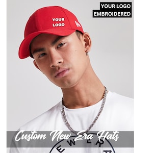 May include: A red baseball cap with a curved peak, displaying the text "YOUR LOGO" embroidered on the front. The image also includes the text "YOUR LOGO EMBROIDERED" and "Custom New Era Hats".