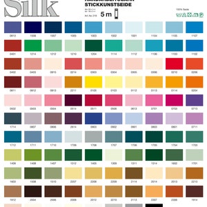 May include: A color chart with 100% silk embroidery thread. The chart is divided into 10 rows and 12 columns, with each square containing a different color of thread. The chart is labeled with the brand name "MADERA" and the text "Farbkarte WFK 121".