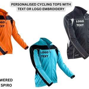 May include: Three cycling tops with black, orange, and blue color combinations. Each top has a zipper closure and a black stripe across the chest with the text "LOGO TEXT" printed in black. The tops are long-sleeved and have reflective piping on the sleeves and sides.