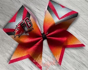 May include: Red, orange, and silver glitter cheer bow with a black and white logo that says "FG Fire Chiefs".