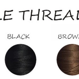 May include: Available thread colors for embroidery: white, grey, black, brown, neon orange, and red. Each color is represented by a spool of thread.