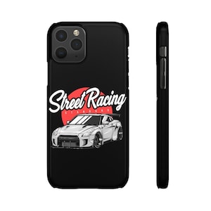 May include: Black phone case with a white sports car and the text "Street Racing" in a red circle.