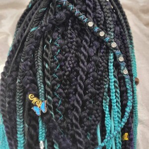 Mixture of braids and twisted dreads in purple ombré and mint ombré.