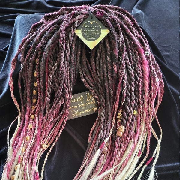 Black-Purple-Red-Blonde ombré in a combination of Braids/Twisted Dreads