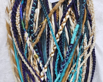 Mixture of Braids, Dreads and Twisted Dreads in a beautiful color arrangement of blondes, purple and teal!