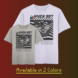 May include: Two t-shirts with a graphic design featuring a skeleton sitting at a computer with the text "WHEN 99?" The t-shirt on the left is gray and the t-shirt on the right is light purple.