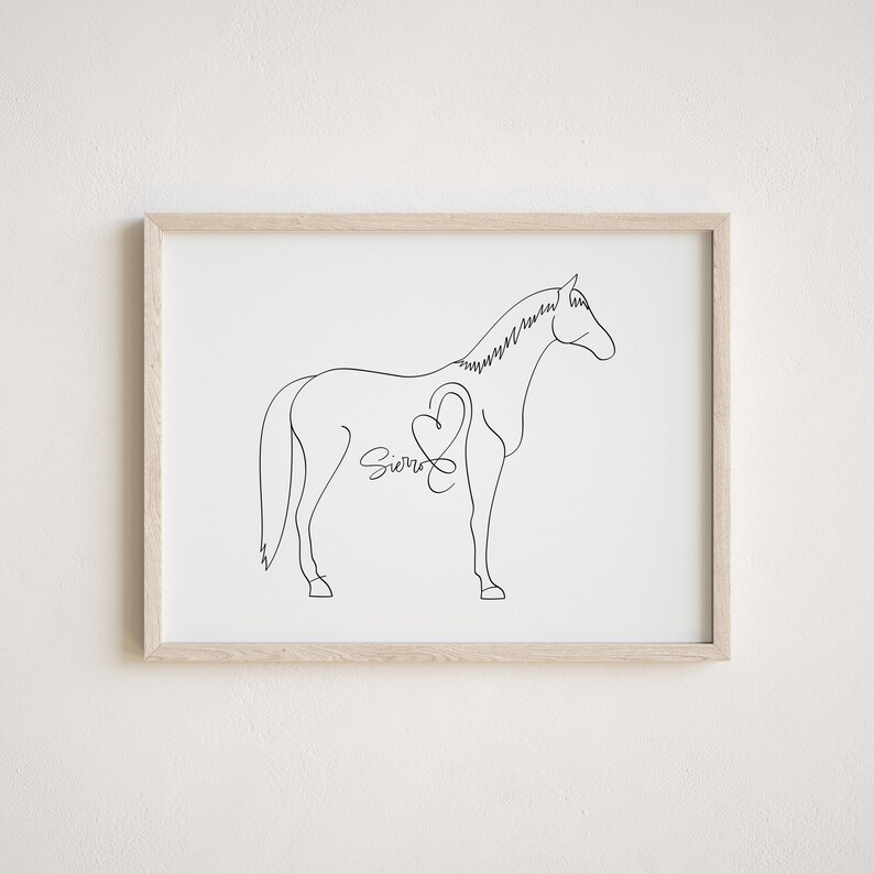 May include: Line art drawing of a horse with a heart and the name "Sierra" inside the heart. The drawing is in black and white and is framed in a light wood frame.