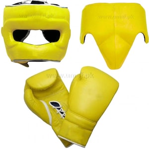 May include: A set of yellow boxing equipment, including a head guard, groin protector, and a pair of boxing gloves. The equipment is made of leather and has a white trim.