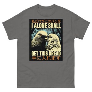 May include: A gray t-shirt featuring a graphic of two pigeons facing each other, with the text "I ALONE SHALL GET THIS BREAD" in English and Japanese. The design has a vintage, slightly distressed look.