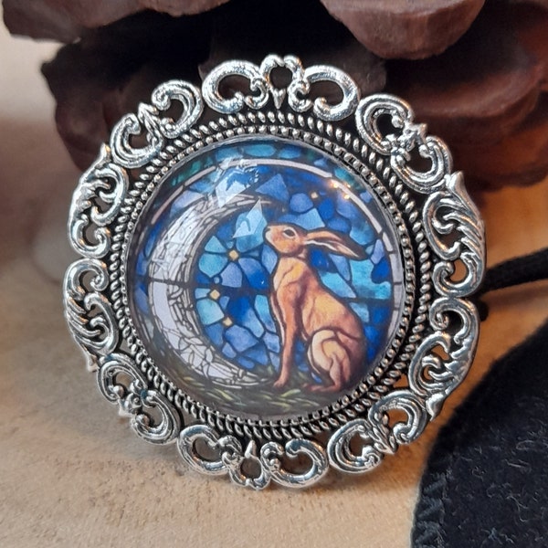 Moon gazing hare pin brooch stained glass silver frame 35mm diameter and gift pouch, jewellery gift for new beginnings and good fortune.