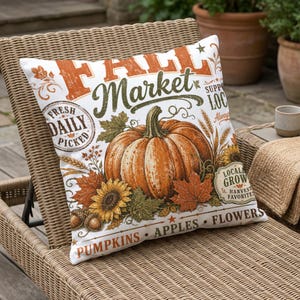 Fall Market pillow with pumpkin, sunflowers, leaves, and text "Fresh Daily Picked," "Pumpkins Apples Flowers."