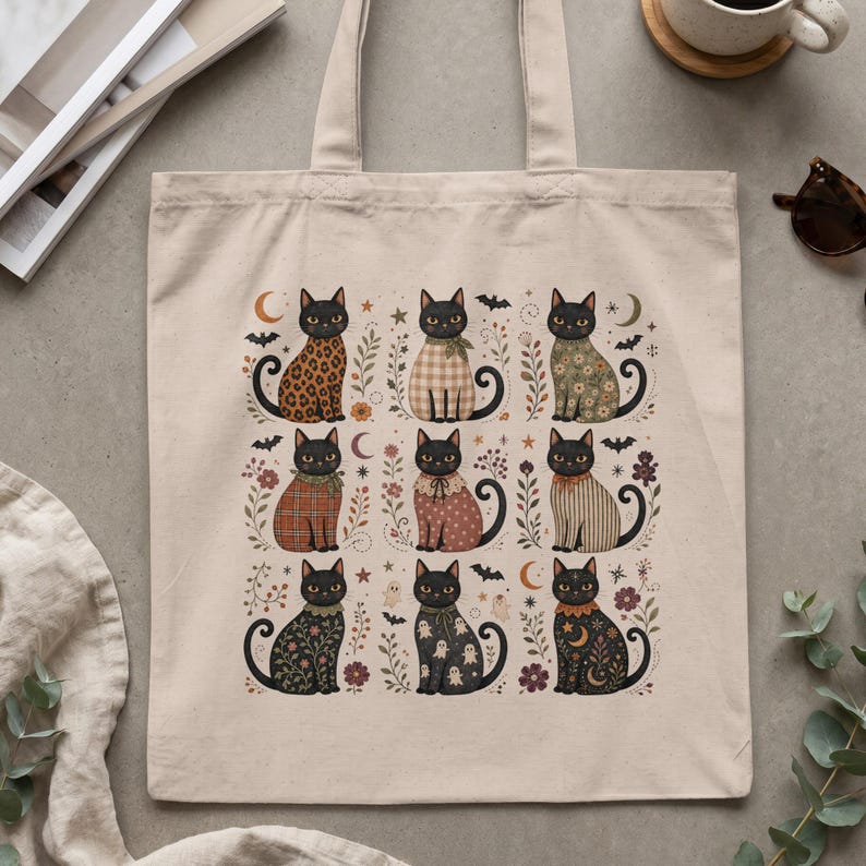 Tote bag with nine illustrated black cats in various Halloween-themed outfits.