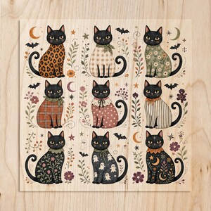 Nine black cats in patterned outfits, surrounded by Halloween and nature motifs.