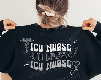 May include: Black sweatshirt with a white graphic design that says "ICU Nurse" three times. The graphic also includes a caduceus, a syringe, a stethoscope, and a heart.