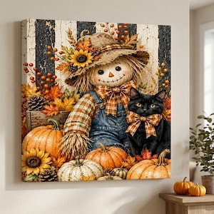 May include: A square canvas wall art print featuring a scarecrow wearing a straw hat adorned with sunflowers and berries, dressed in plaid and denim overalls. A black cat with a plaid bow sits beside pumpkins and autumn leaves on a striped background.