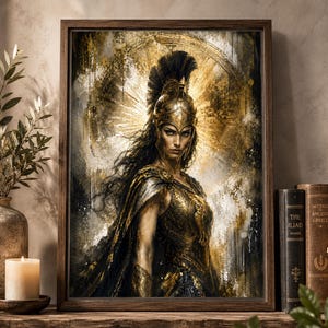 May include: A framed wall art print featuring a portrait of a warrior wearing a golden helmet with a black crest and ornate armor. The figure is set against a textured, abstract background of gold, black, and white tones with a radiant halo effect.