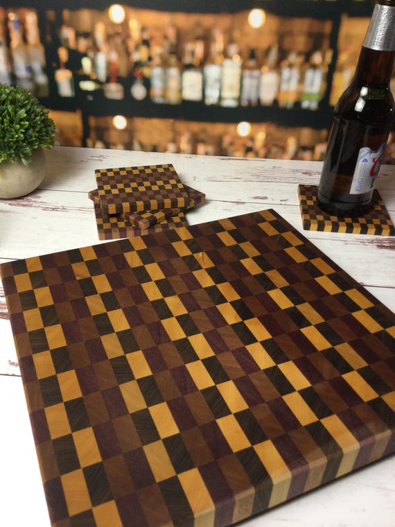 End-grain construction with matching coasters is a genuinely crafted set — the kind of heirloom kitchen piece that doubles as a dinner-table centerpiece.