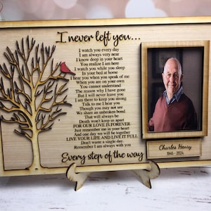 May include: A wooden memorial plaque with a photo of a man and a poem about never leaving. The poem reads "I never left you... I watch you every day... I am always very near... I know deep in your heart... You realize I am here... I watch you while you sleep... In your bed at home... I hear you when you speak of me... When you are on your own... You cannot understand... The reason why I have gone... But I will never leave you... I am there to keep you strong... Talk to me I hear you... Though you may not see... We share an unbroken bond... That will always be... Death won't keep us apart... FOR OUR LOVE IS FOREVER... Just remember me in your heart... And one day we will be together... LIVE YOUR LIFE AND LIVE IT FULL... Don't waste a single day... Remember I am always with you... Every step of the way." The plaque also includes the name "Charles Henry" and the dates "1945-2024".