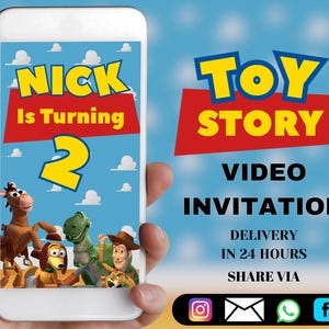 May include: A smartphone displays a "Toy Story" video invitation. The invitation features the text "Nick Is Turning 2" in yellow and red, with cartoon characters. The background is a blue sky with white clouds. The "Toy Story" logo is at the top.