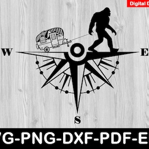 May include: Black and white compass with a silhouette of a Bigfoot holding a camper trailer. The compass points north, south, east, and west.
