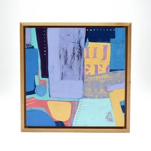 May include: Abstract painting in a wooden frame. The artwork features a collage of shapes in shades of blue, purple, yellow, and coral. The composition includes areas with visible brushstrokes and the letters "HIJ" and "EFG".