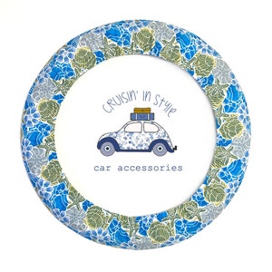 May include: A blue and green floral patterned car steering wheel cover with the text "Cruisin' in Style car accessories".