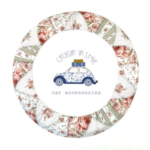 May include: A floral patterned steering wheel cover with a patchwork design. The cover features red roses, green leaves, and white fabric. The text "cruisin' in style car accessories" is also visible.